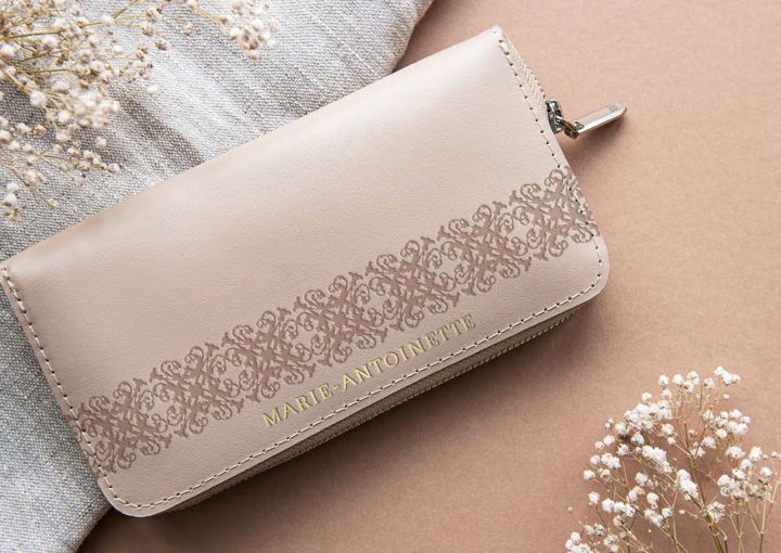 Beige clutch with lace pattern